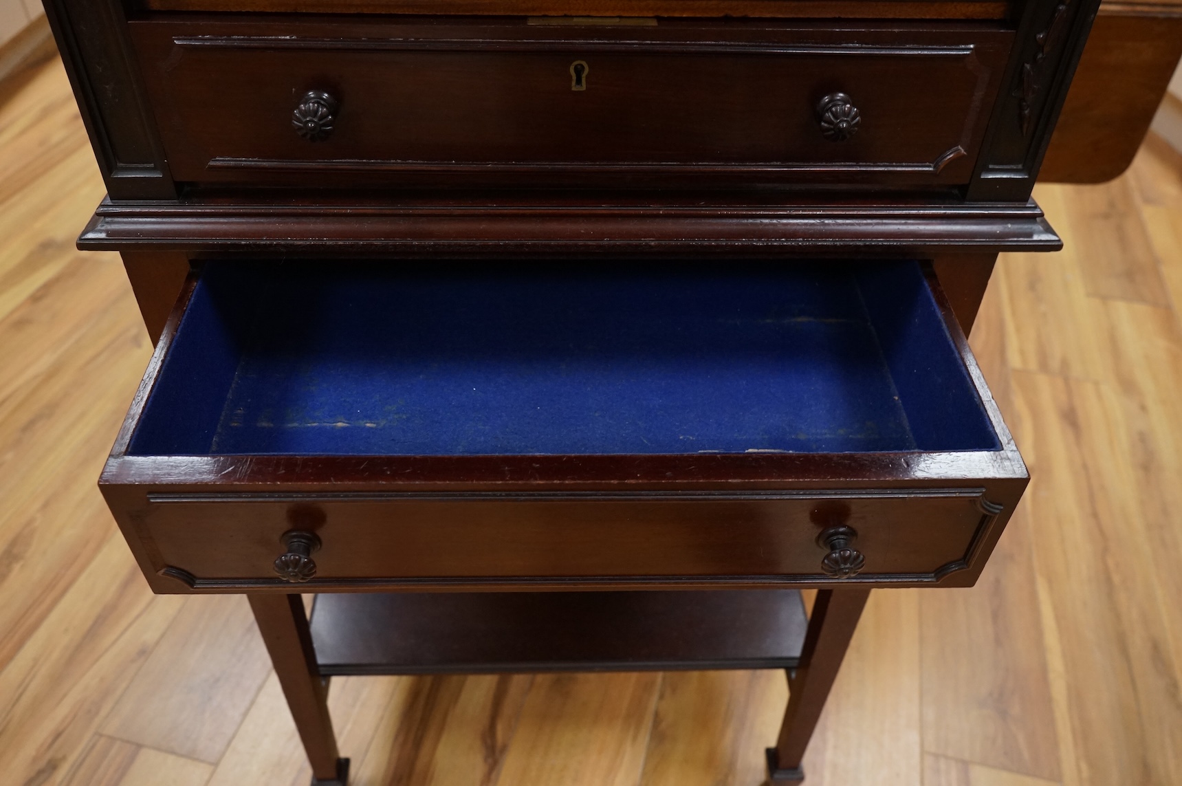 A canteen of cutlery by Viners, contained within a four drawer floor standing cabinet. 110cm tall